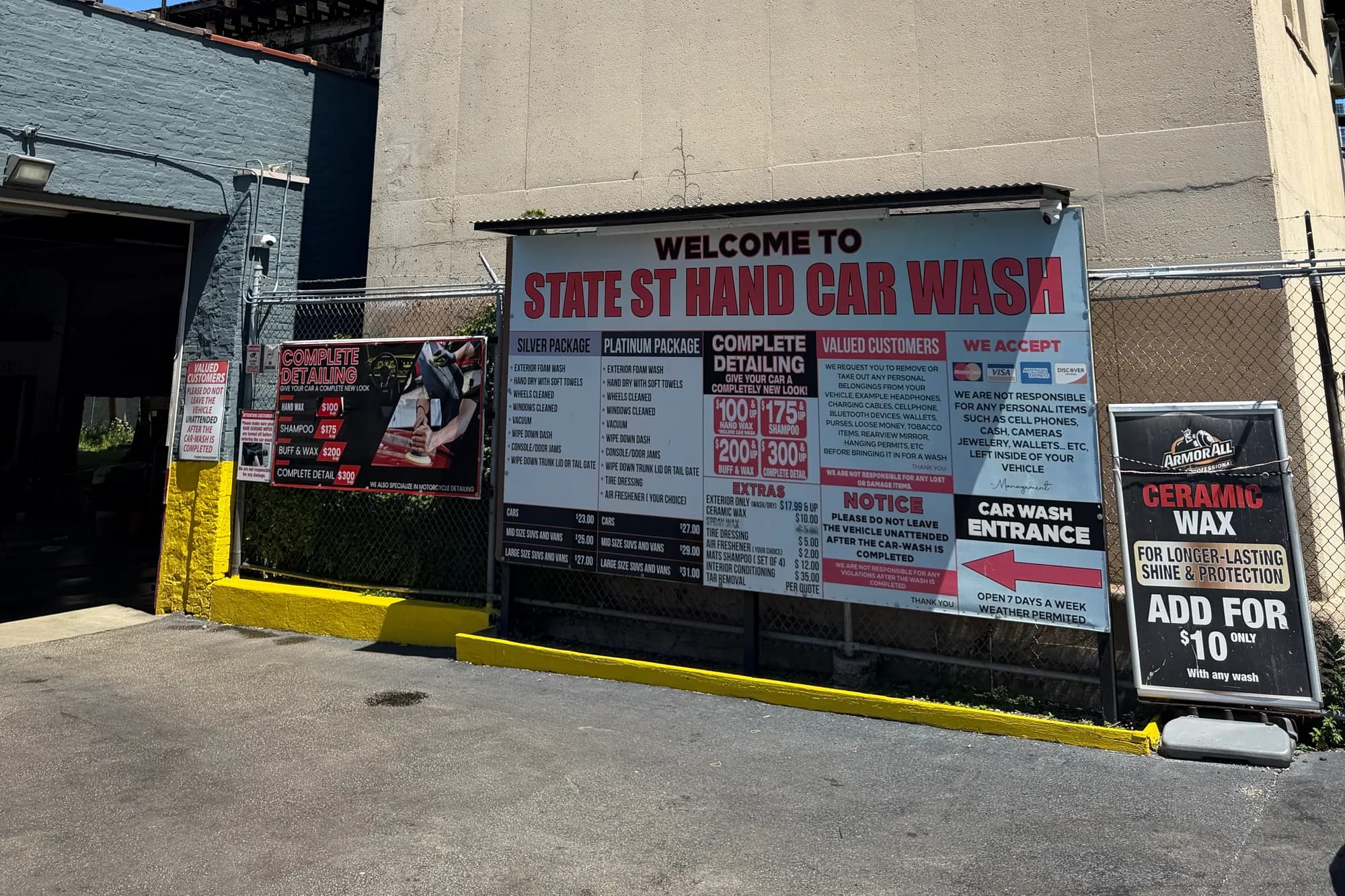 The current service and pricing banner beside the car wash entrance